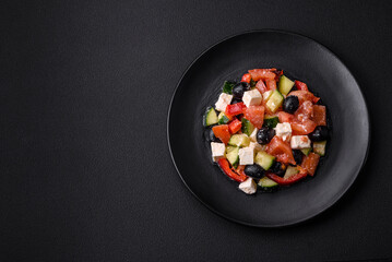 Delicious fresh Greek salad with olives, tomatoes, cucumbers and feta cheese