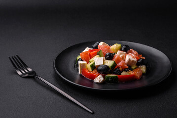 Delicious fresh Greek salad with olives, tomatoes, cucumbers and feta cheese