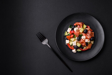 Delicious fresh Greek salad with olives, tomatoes, cucumbers and feta cheese