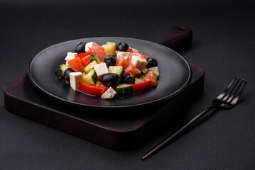Delicious fresh Greek salad with olives, tomatoes, cucumbers and feta cheese