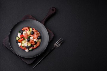 Delicious fresh Greek salad with olives, tomatoes, cucumbers and feta cheese