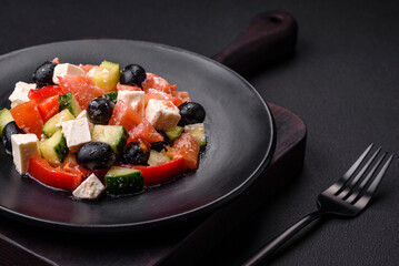 Delicious fresh Greek salad with olives, tomatoes, cucumbers and feta cheese