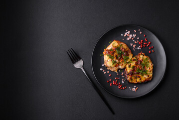 Meat baked in the oven with pineapple, tomatoes, cheese, spices and herbs
