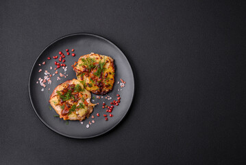Meat baked in the oven with pineapple, tomatoes, cheese, spices and herbs