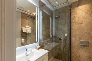 Interior of a modern bathroom with shower cabin