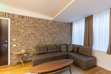 Interior of a modern hotel apartment with brick wall decoration