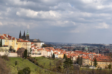 Fototapeta na wymiar Old town of Prague. Czech Republic over river Vltava with Charles Bridge on skyline. Prague panorama landscape view with red roofs.