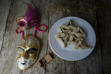 Background with Purim Party elements with mask and wafers Homentasch