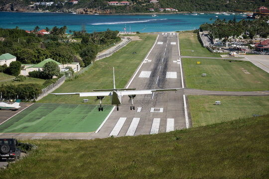 Aircraft landing on the runway at R&eacute;my de Haenen Airport on the French Caribbean island of St Barth (Saint Barthelemy)