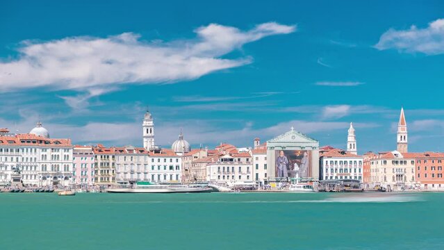 Venice panorama timelapse with Doge's Palace, Santa Maria della Visitazione seen from the bell tower of the St. George. Blue cloudy sky at summer day