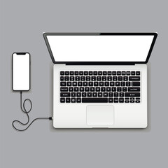 USB cable connects phone and laptop