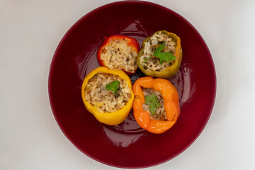 Stuffed peppers, colorful peppers stuffed with rice, top view. (Turkish name; stuffed peppers)