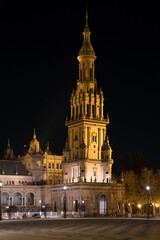 Fototapeta na wymiar Tower in the Plaza de España in Seville (Andalusia, Spain). Plaza de España at night. Most famous place in the city of Seville.