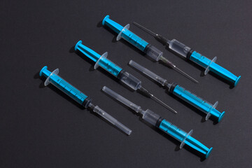 Disposable plastic syringe prepared for injection and vaccination in the hospital. The concept of medicine and health