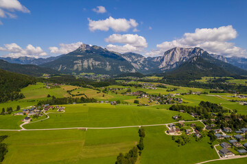 Fototapeta na wymiar View of the village, fields and forest in mountains Alps Austria
