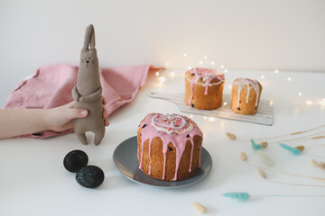 Easter cake, colorful eggs and rabbit toy. Happy Easter holiday concept. festive spring season