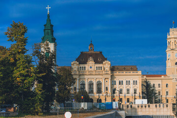 Fototapeta na wymiar Explore the historic old buildings of Oradea, from ancient fortresses to elegant palaces and museums. Embrace the hustle and bustle of city life in Oradea with this busy street photo