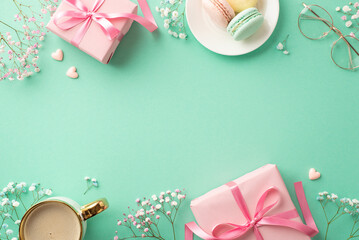 Mother's Day concept. Top view photo of pink gift boxes with bows plate with macarons cup of fresh coffee stylish glasses hearts and gypsophila flowers on isolated turquoise background with copyspace