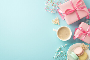 Saint Valentine's Day concept. Top view photo of pink gift boxes with bows plate with macaroons cup of coffee rattan hearts and gypsophila flowers on isolated light blue background with empty space