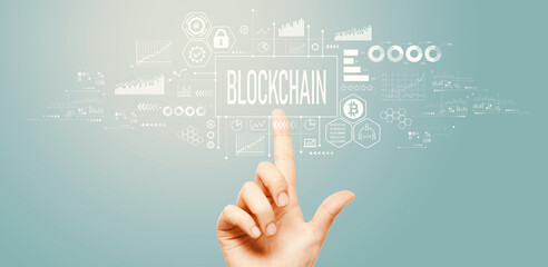 Blockchain theme with hand pressing a button on a technology screen