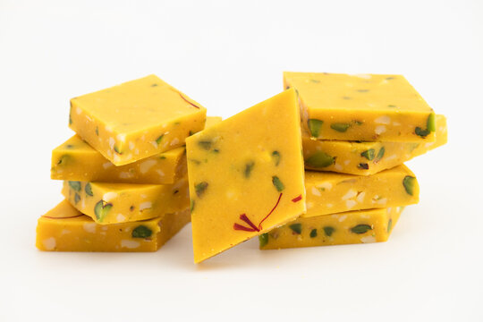 Indian Diamond Shaped Mithai Kesar Pista Kaju Barfi Is Saffron Infused Kajoo Katli Barfi Made Of Cashewnuts, Pistachio, Doodh, Condensed Milk Powder Prepared In Pure Desi Ghee Or Clarified Butter
