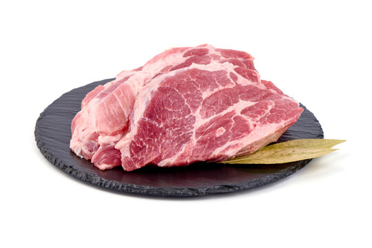 Raw pork shoulder steaks, isolated on white background. High resolution image.