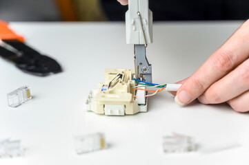 installing a network cable into a prefabricated RJ45 module using the LSA punch down tool, ethernet...