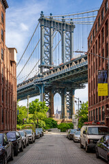 Fototapeta na wymiar Manhattan Bridge seen from Washington Street in Brooklyn, New York with Empire State Building in the background
