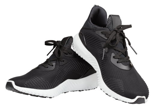 Pair of new unbranded black sport running shoes, sneakers or trainers isolated on transparent background