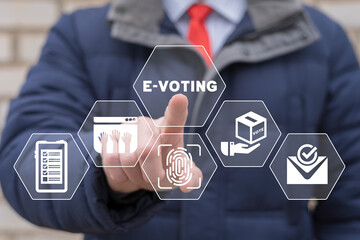 Businessman using virtual touch screen presses inscription: E-VOTING. Mixed environment, e-voting...