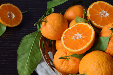 Close up of fresh and tasty tangerines with leaves