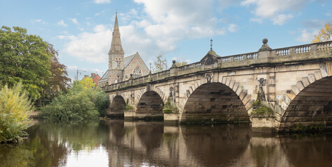 Wiew of the Engish Bridge and United Reformed Church across the River Severn in Shrewsbury in Shropshire, UK