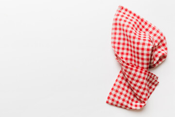 top view with red empty kitchen napkin isolated on table background. Folded cloth for mockup with copy space, Flat lay. Minimal style