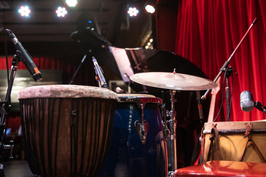 Drumming kit and professional sound set for a Jazz live concert at Latin festival in an intimate club. Copy space.