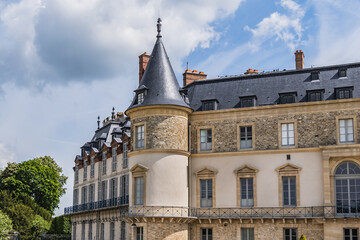 Fototapeta na wymiar Fragments of Chateau de Rambouillet (Castle of Rambouillet, XIV century) in picturesque Public Park in town of Rambouillet. Yvelines department, Ile-de-France region, 50 km southwest of Paris. France.