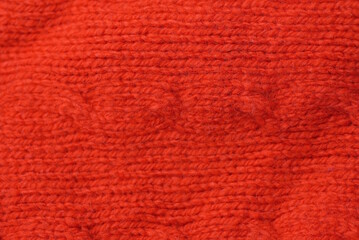 red texture of wool fabric on clothes made of sweaters