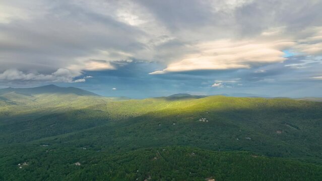 Flying over the Campton Mountain in summer with White Mountain National Forest at the background in town of Campton, New Hampshire NH, USA. 