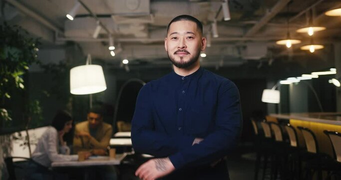 Asian man freelancer has business meeting in cafe workspace