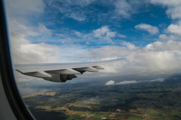 flying and traveling. Airplane interior or jet window with clouds and sky. Sky view from a high angle on the plane. 