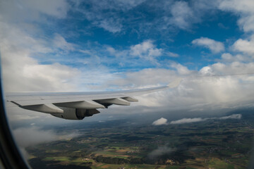Fototapeta premium flying and traveling. Airplane interior or jet window with clouds and sky. Sky view from a high angle on the plane. 