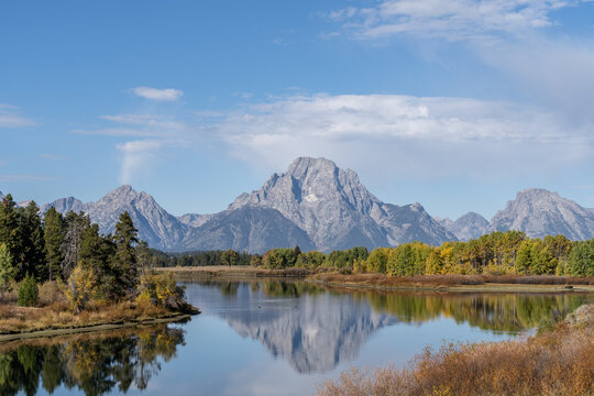 Mt. Moran and the Grand Tetons reflected in still water of the Snake River at Oxbow Bend in Autumn
