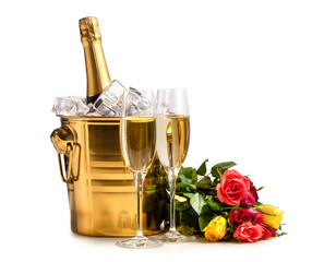 Two glasses of champagne, a bucket with a bottle of champagne and ice and a bouquet of multi-colored roses on a white background