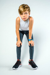 Young male athlete bent over exhausted after running race