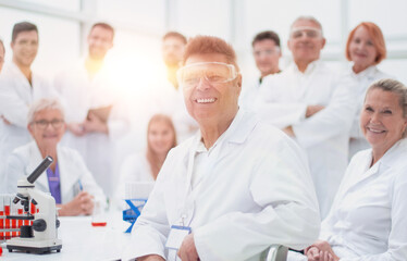 portrait of a successful supervisor and his team in the laboratory .