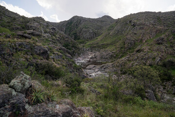 View of river Yuspe flowing along the rocky hills and forest.