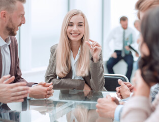 young businesswoman explaining new tasks at a working meeting.