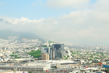 Picturesque view of cityscape with many buildings near mountain