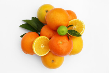 Naklejka na ściany i meble Different citrus fruits and leaves on white background, top view