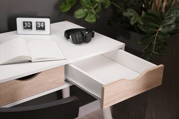 Stylish desk with open empty drawer in office - obrazy, fototapety, plakaty