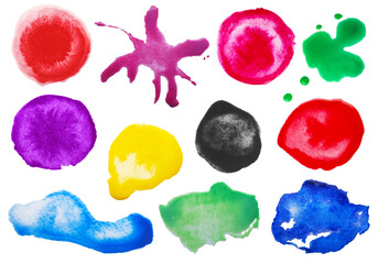 Set with colorful blots of ink on white background, top view